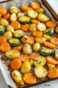 Irresistible Garlic Herb Roasted Potatoes Carrots And Zucchini Recipe